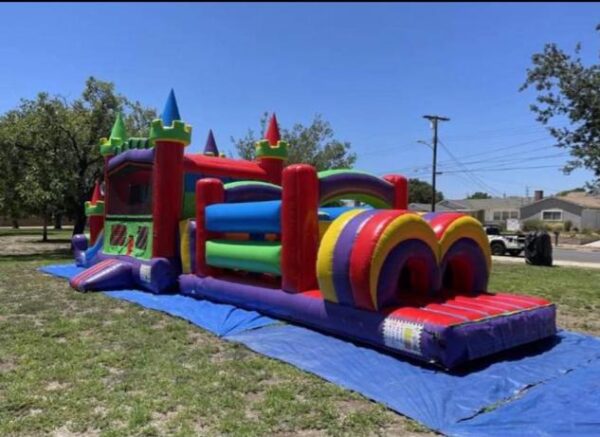 Bounce house obstacle combo slide